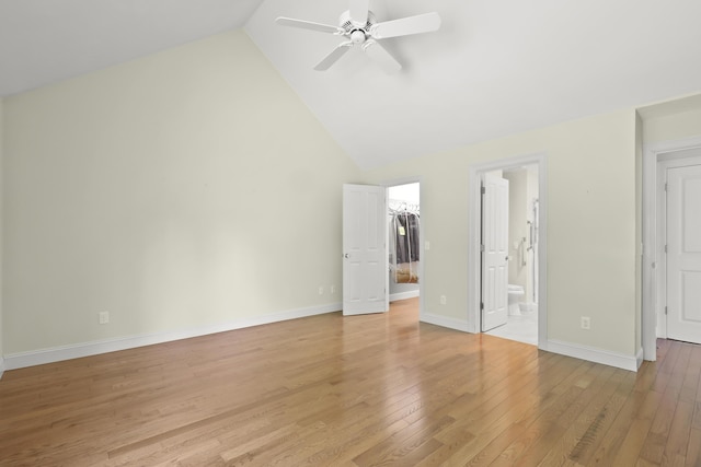 21 Pine St Unit 1Au, North Falmouth, MA 02556 - unfurnished bedroom featuring light wood-style floors, a spacious closet, ensuite bath, a closet, and high vaulted ceiling