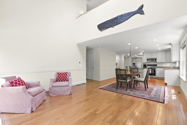 21 Pine St Unit 1Au, North Falmouth, MA 02556 - dining room with light wood finished floors and recessed lighting