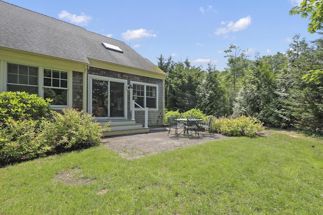 21 Pine St Unit 1Au, North Falmouth, MA 02556 - view of green lawn featuring entry steps and a patio