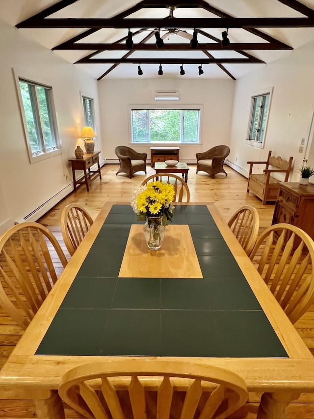 27 Long View Dr, Orleans, MA 02653 - dining area featuring healthy amount of natural light, an AC wall unit, a baseboard heating unit, and beamed ceiling