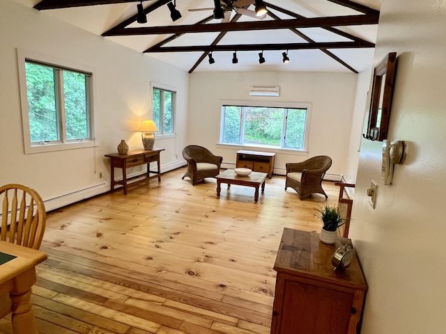 27 Long View Dr, Orleans, MA 02653 - living area featuring a wall mounted AC, a ceiling fan, light wood-style floors, beam ceiling, and a baseboard radiator