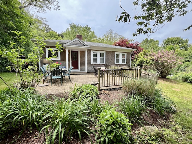 27 Long View Dr, Orleans, MA 02653 - back of property with a chimney and a wooden deck