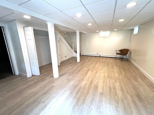 27 Long View Dr, Orleans, MA 02653 - below grade area featuring baseboard heating, light wood-style flooring, baseboards, stairs, and recessed lighting