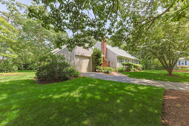 21 Gramps Way S, Chatham, MA 02659 - view of side of property with a yard, a chimney, and asphalt driveway