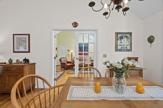 21 Gramps Way S, Chatham, MA 02659 - dining room with light wood-style flooring, a chandelier, and high vaulted ceiling