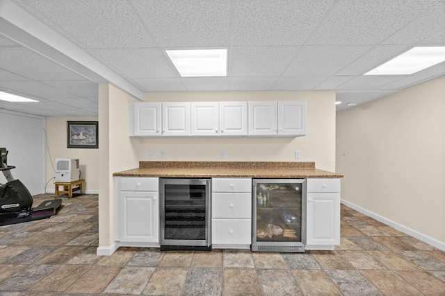 21 Gramps Way S, Chatham, MA 02659 - indoor dry bar with wine cooler, light stone finish floors, and a paneled ceiling