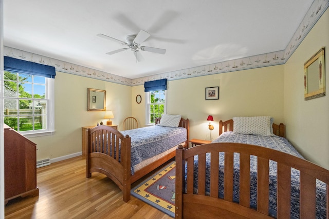 21 Gramps Way S, Chatham, MA 02659 - bedroom featuring multiple windows, light wood-style flooring, and a ceiling fan