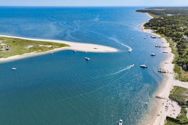 drone / aerial view with a water view and a beach view