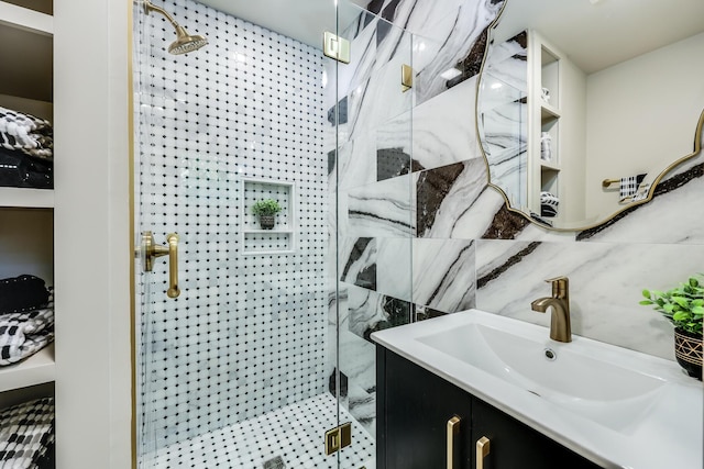 full bath featuring backsplash, a shower stall, vanity, and tile walls