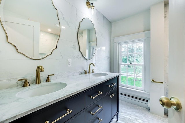 bathroom with baseboard heating and vanity