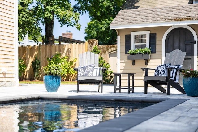 view of swimming pool featuring a patio