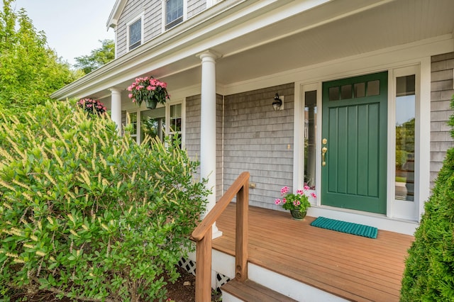 view of exterior entry with covered porch