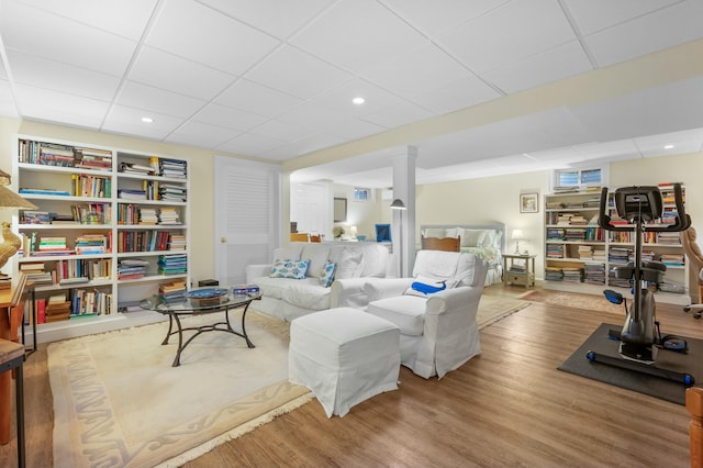 living area featuring wood finished floors and recessed lighting