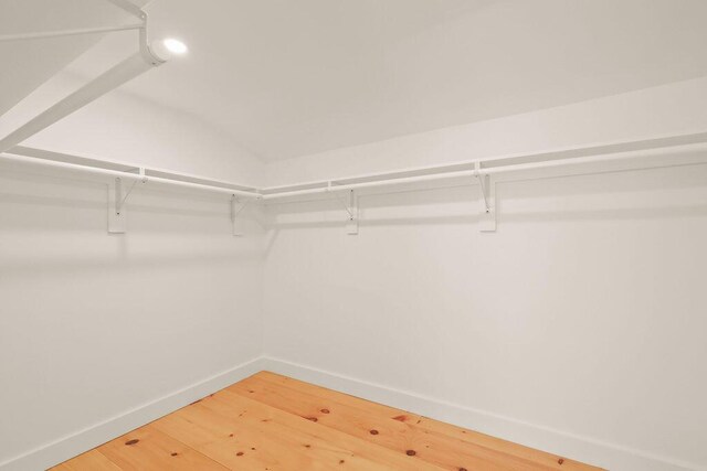 2 Little Cove Ln, Orleans, MA 02653 - spacious closet featuring light wood-style flooring and lofted ceiling