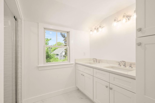 2 Little Cove Ln, Orleans, MA 02653 - full bathroom featuring marble look tile flooring, baseboards, double vanity, and lofted ceiling