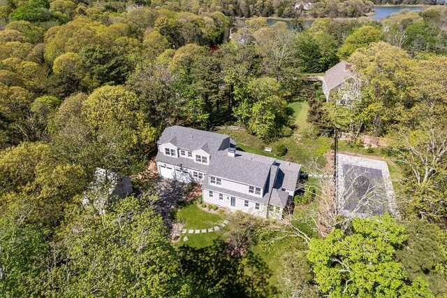 2 Little Cove Ln, Orleans, MA 02653 - view of subject property featuring a heavily wooded area and a nearby body of water