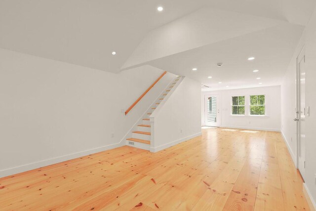 2 Little Cove Ln, Orleans, MA 02653 - unfurnished living room featuring light wood-style flooring, stairway, recessed lighting, lofted ceiling, and baseboards