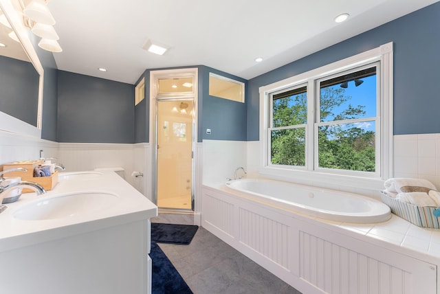 23 Crowell Ln, Tisbury, MA 02568 - full bath featuring a shower stall, a bath, wainscoting, double vanity, and tile patterned floors