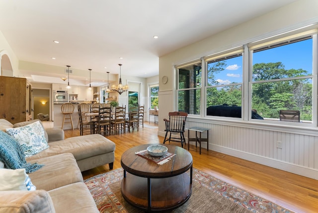 23 Crowell Ln, Tisbury, MA 02568 - living area with light wood finished floors, a chandelier, and recessed lighting