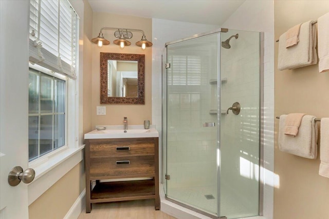 44 Commercial St, Provincetown, MA 02657 - bathroom featuring a stall shower, vanity, and wood finished floors