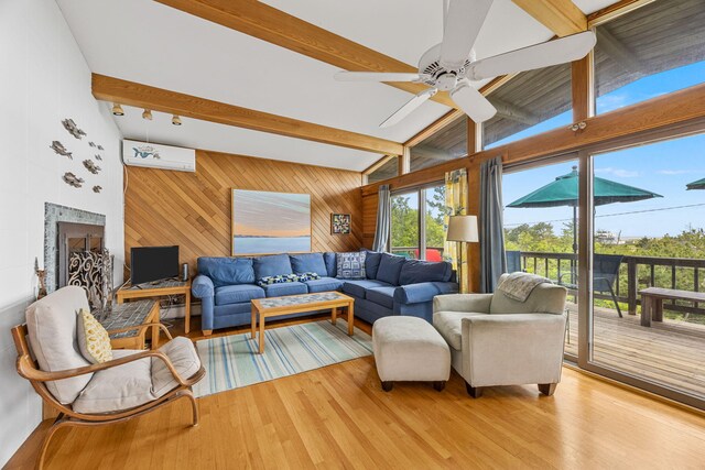 5 Great Hills Rd, Truro, MA 02666 - living area with a wall mounted air conditioner, wood walls, wood finished floors, and ceiling fan