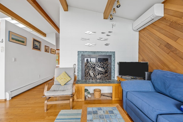 5 Great Hills Rd, Truro, MA 02666 - living room with a baseboard radiator, a wall mounted air conditioner, a tile fireplace, and wood finished floors