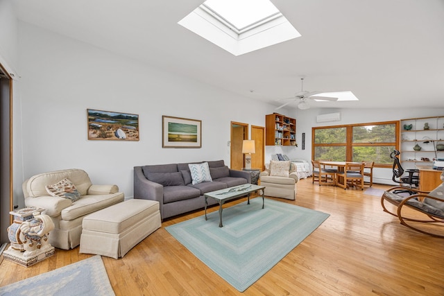 5 Great Hills Rd, Truro, MA 02666 - living room featuring a skylight, light wood-type flooring, vaulted ceiling, a wall mounted air conditioner, and ceiling fan