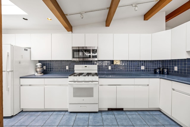 5 Great Hills Rd, Truro, MA 02666 - kitchen with white appliances, beam ceiling, dark countertops, backsplash, and white cabinetry