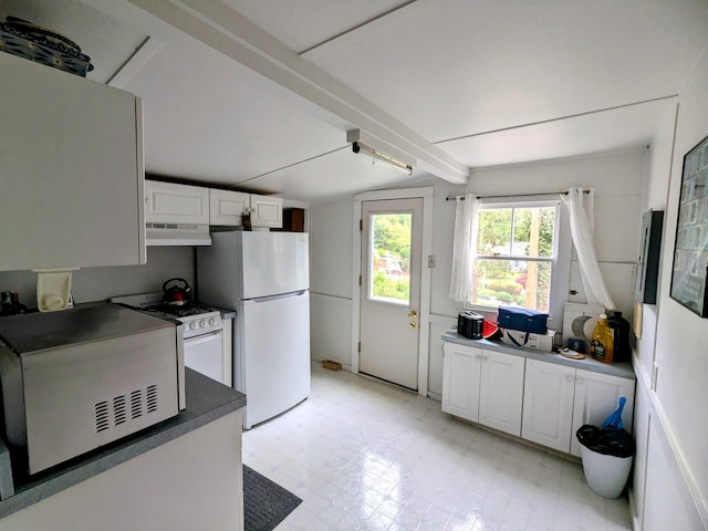62 Old Fish House Rd, South Dennis, MA 02660 - kitchen featuring under cabinet range hood, white appliances, dark countertops, white cabinets, and light floors