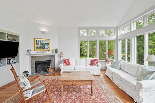 20 James Pond Way, West Tisbury, MA 02575 - living room with wood finished floors, a premium fireplace, and lofted ceiling