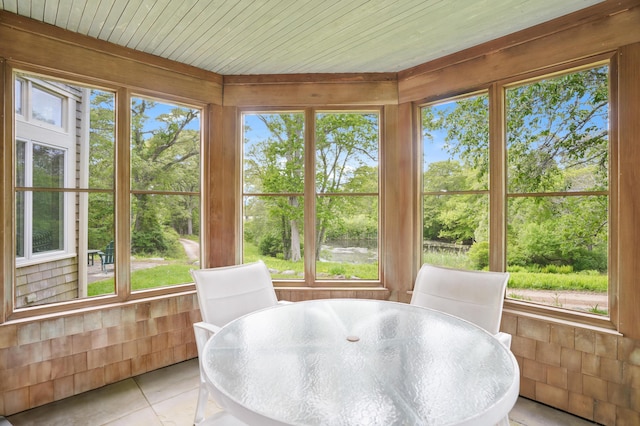 20 James Pond Way, West Tisbury, MA 02575 - sunroom / solarium featuring outdoor dining area, healthy amount of natural light, tile patterned floors, and view of scattered trees