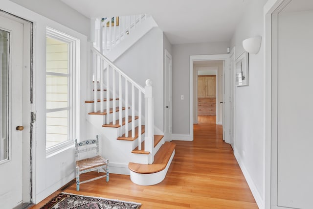 20 James Pond Way, West Tisbury, MA 02575 - foyer entrance with light wood-type flooring, stairs, and baseboards