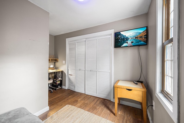 239 Upper County Rd, South Dennis, MA 02660 - bedroom featuring wood finished floors, a closet, baseboards, and a desk