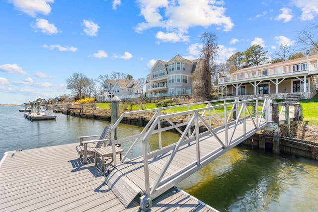 view of dock with a deck with water view