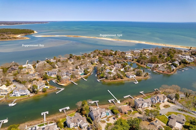 drone / aerial view with a water view and a residential view
