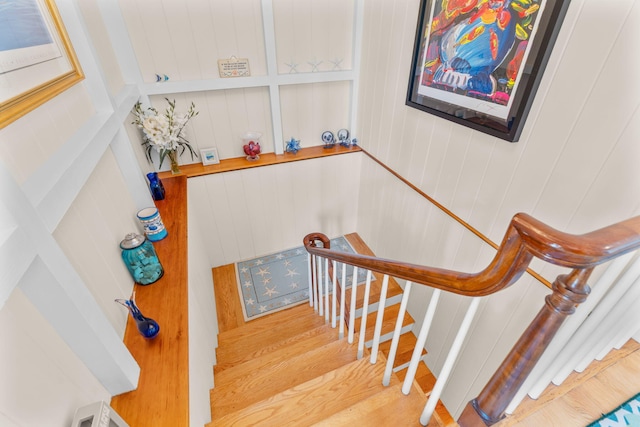 staircase with wood finished floors