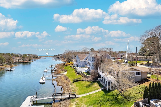 view of water feature featuring a dock and a residential view