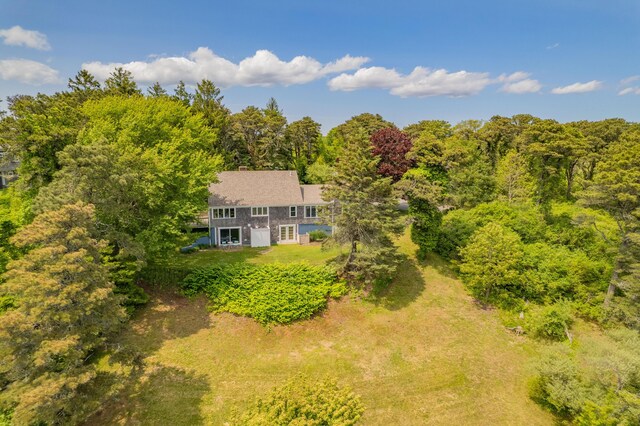 9 Bettys Path, Chatham, MA 02633 - view of front of home featuring a garage, a shingled roof, and a chimney