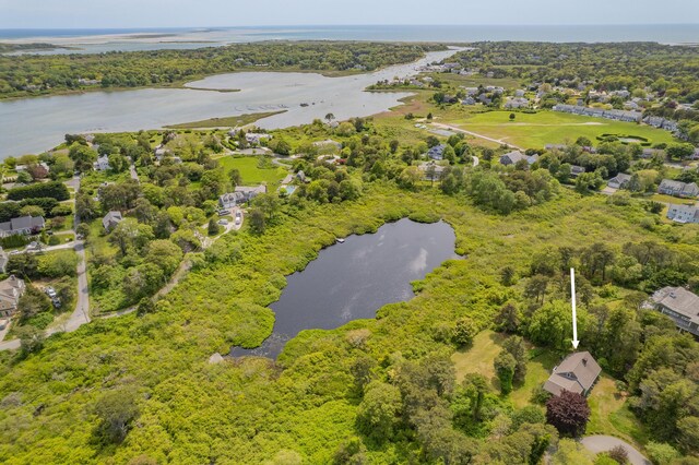 9 Bettys Path, Chatham, MA 02633 - rear view of house with a wooden deck, a lawn, and french doors