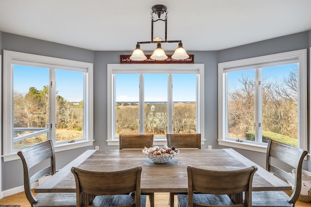 dining area featuring plenty of natural light and baseboards