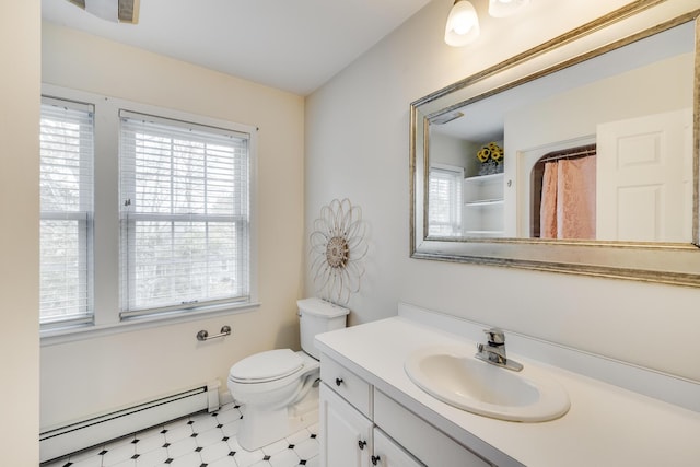 bathroom featuring tile patterned floors, toilet, curtained shower, baseboard heating, and vanity