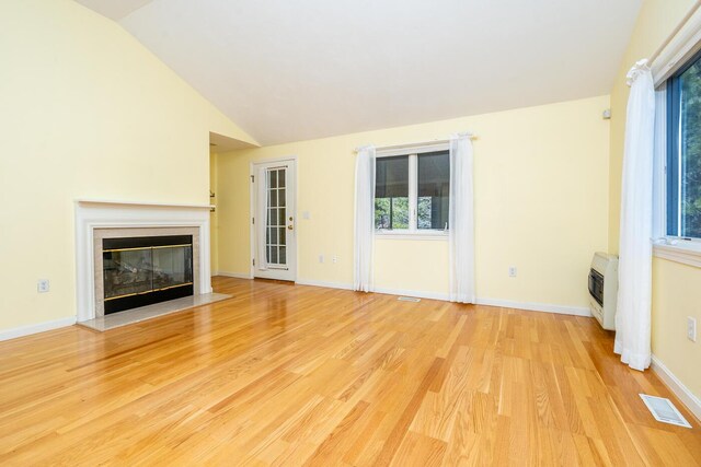 unfurnished bedroom featuring vaulted ceiling, carpet, and baseboards