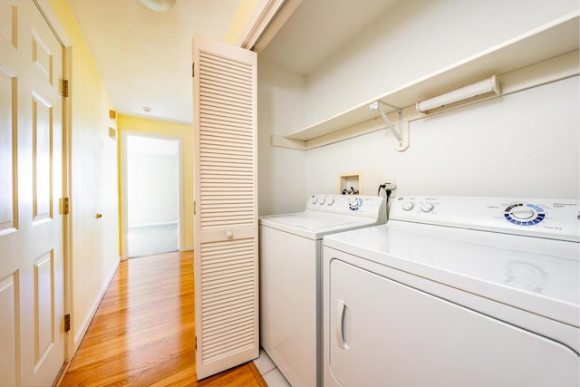 115 Pine Hill Blvd, Mashpee, MA 02649 - washroom with washer and dryer and light wood-style flooring