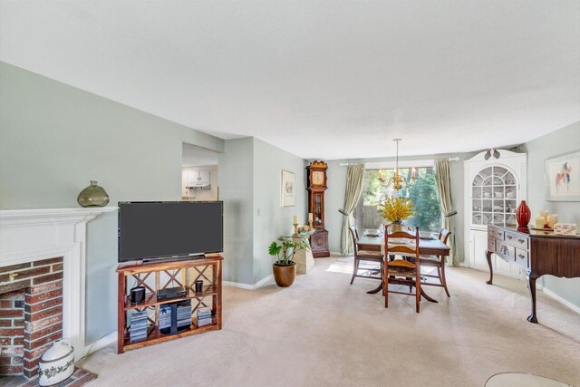 33 Swift Brook Rd, South Yarmouth, MA 02664 - dining space featuring a chandelier, a fireplace, and light carpet