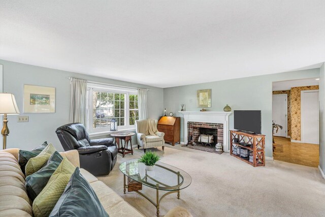 33 Swift Brook Rd, South Yarmouth, MA 02664 - living room featuring a brick fireplace and light colored carpet