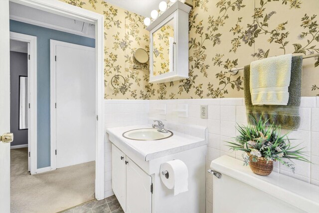 33 Swift Brook Rd, South Yarmouth, MA 02664 - bathroom featuring tile patterned floors, tile walls, toilet, and vanity