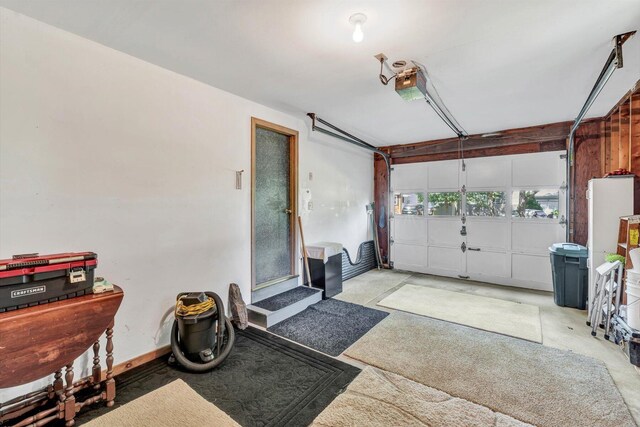 33 Swift Brook Rd, South Yarmouth, MA 02664 - garage featuring water heater and a garage door opener