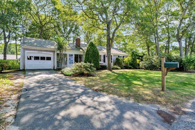 33 Swift Brook Rd, South Yarmouth, MA 02664 - ranch-style house with a garage and a front lawn