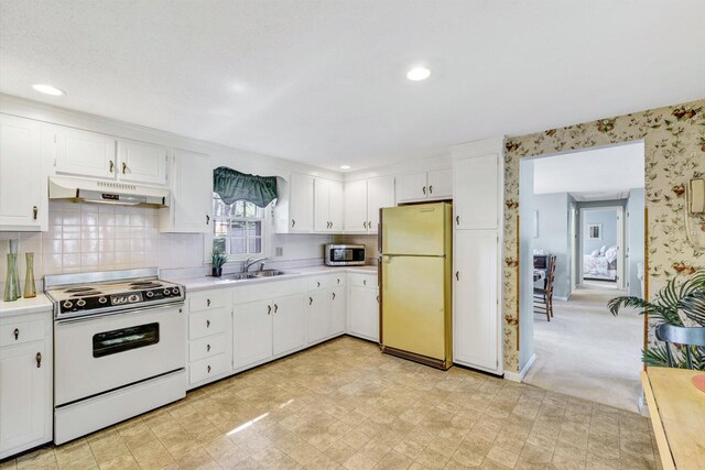 33 Swift Brook Rd, South Yarmouth, MA 02664 - kitchen with white range with electric cooktop, fridge, sink, light colored carpet, and white cabinetry