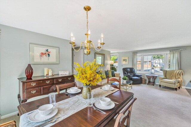 33 Swift Brook Rd, South Yarmouth, MA 02664 - dining room with light colored carpet and a notable chandelier